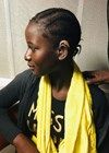 Mariama being fitted with hearing aids