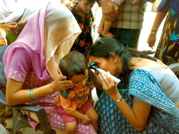 At home doing community outreach in India.