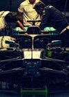 Formula One team photo - mechanics working on racing car