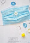 Photo of the 'SNAP', a one-way valve which will fit to any surgical mask.