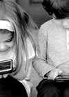 Experience of a Paediatric Audiologist photo of children using mobile phones