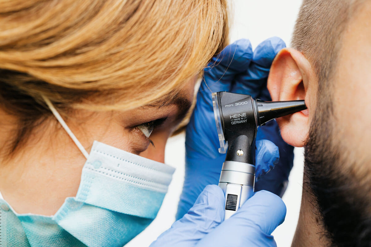 Photo showing an ear examination.