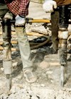 Image of workmen using pneumatic drills.