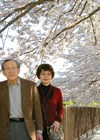 Photo showing Nobuhiko and Keiko and the cherry trees near their house.