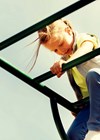 Photo of child climbing playground appatus.