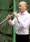 Photo of Russell Tyler playing the oboe.