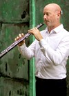 Photo of Russell Tyler playing the oboe.