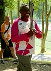 Photo showing Brian carrying the Birmingham 2022 Commonwealth Games Queen’s Relay Baton.