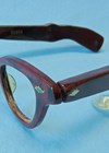 Photo showing the Acousticon Model A-230 eyeglass hearing aid.