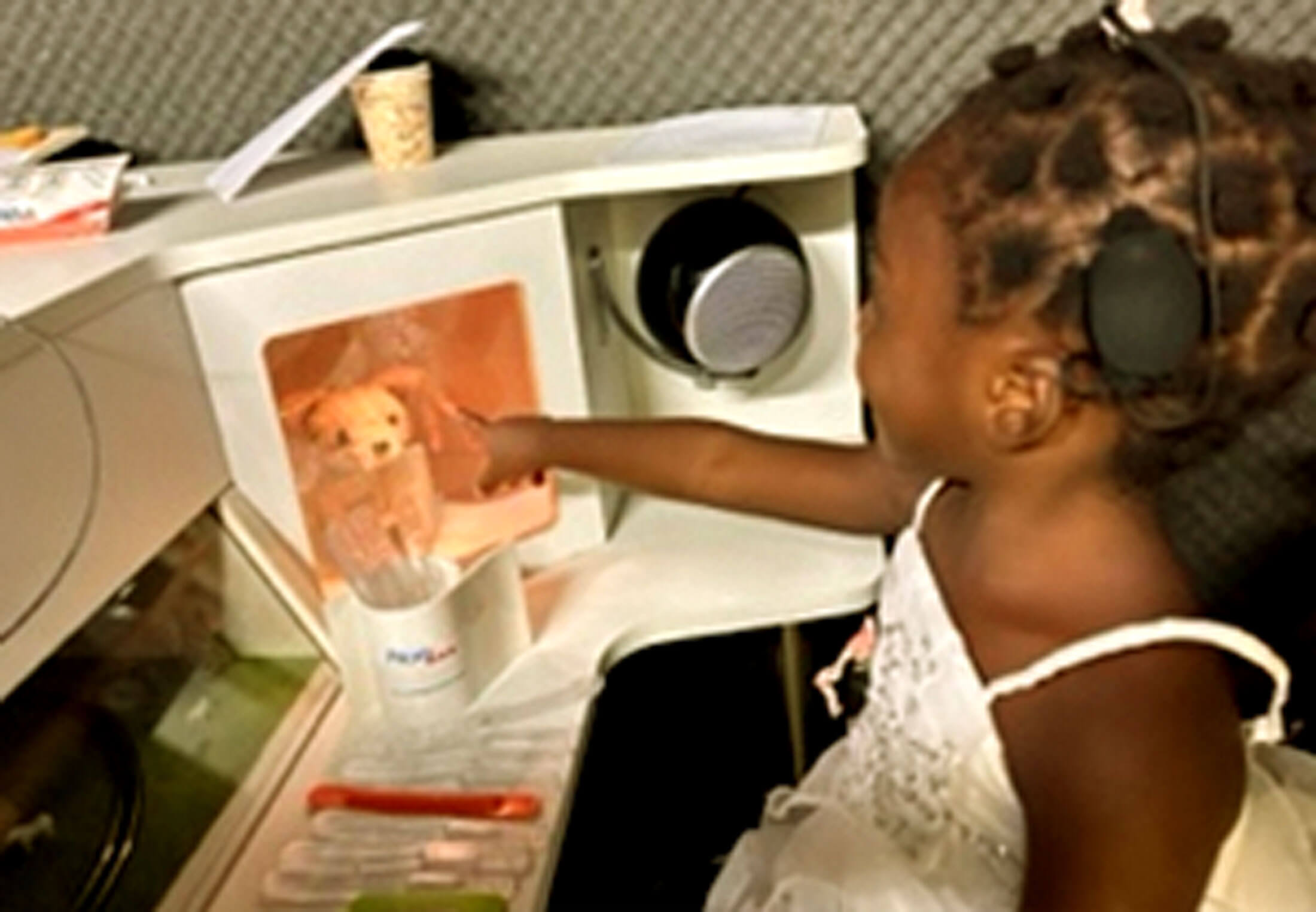 Photo of child with cochlear implant.