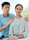 Image depicting a medical person delivering bad news to a patient.