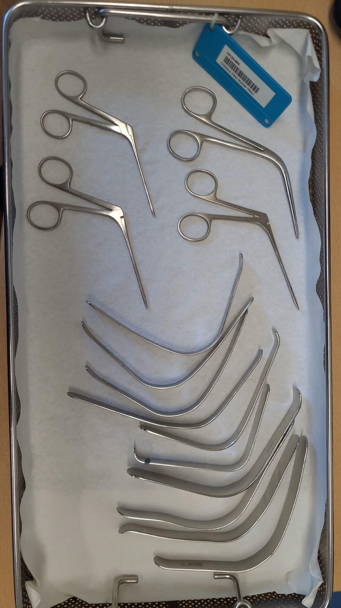 Photo showing reusable metal ENT instruments in tray.