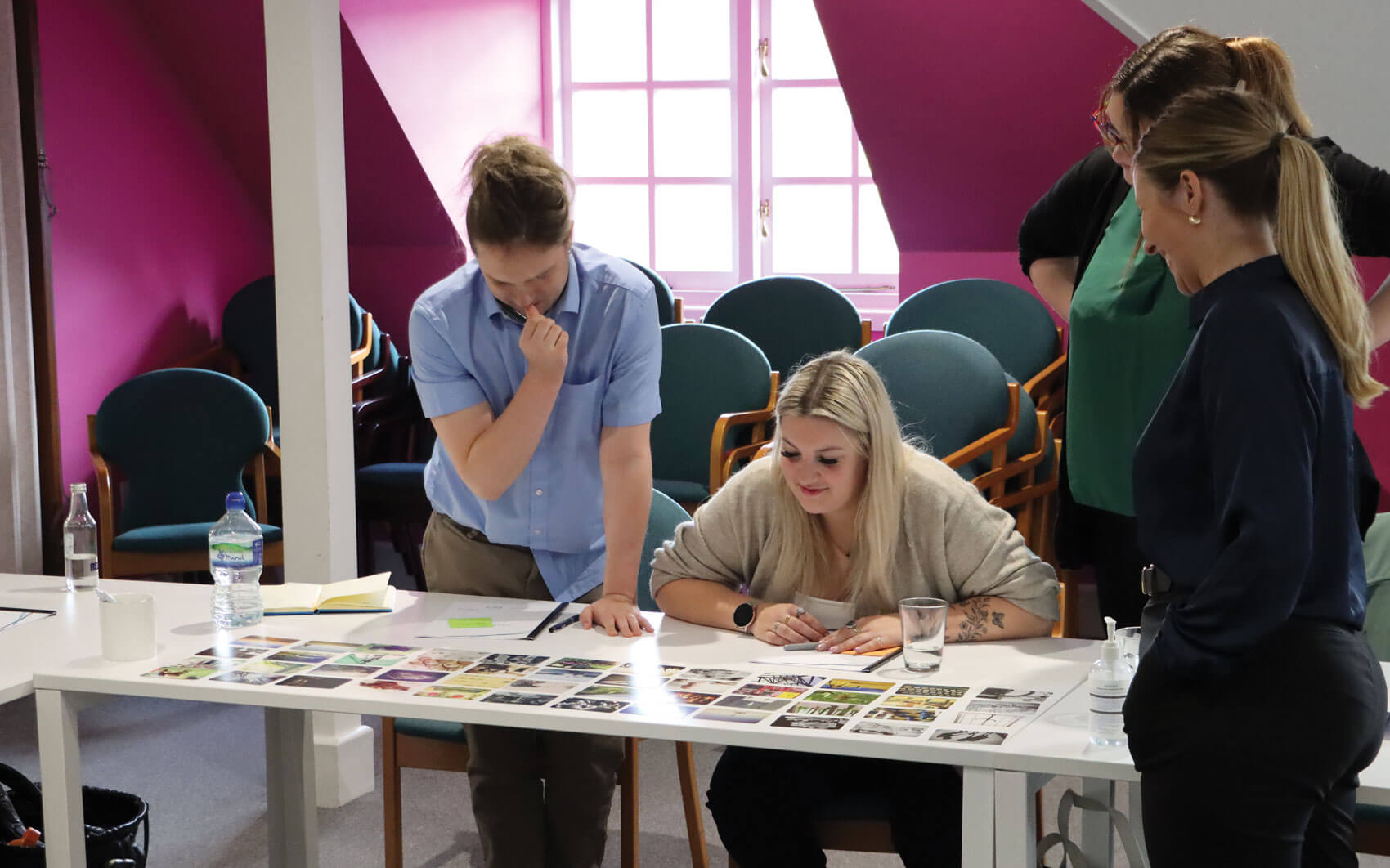 Photos showing a group exercise designed to help ‘find our best self’, using cards and images to display this.