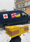 Photo showing the box of hearing aids arriving in Kyiv.