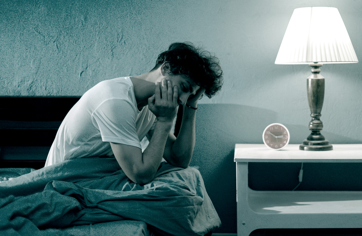Photo of man having sleeping issues.